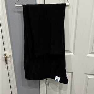 Secretly Slimming Black polyester spandex. Velvety fabric.